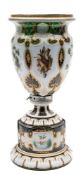 A Bohemian green overlay glass vase: of footed form,