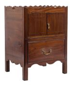 A George III mahogany and later adapted trap top commode:, the shaped top with carrying handles,