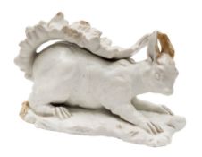 A rare Chelsea white-glazed model of a red squirrel: naturistically modelled with head turned