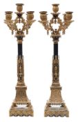 A pair of Willian IV patinated gilt-metal five-light candelabra: of neo-gothic form in the manner