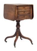 A Regency mahogany drop flap work table:, the hinged top with rounded corners and a moulded edge,