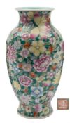 A Chinese famille rose millefleur vase: of baluster form with waisted neck and everted rim,