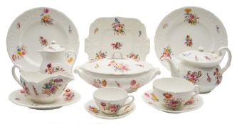 An extensive Coalport porcelain part dinner and tea service: moulded with acanthus scrollwork and