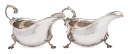 A pair of George V silver sauceboats, maker Asprey & Co, London, 1916: with wavy edge border,