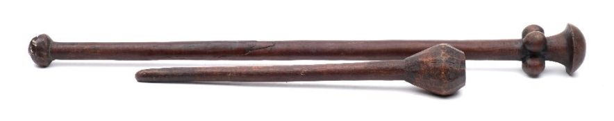 An African knobkerrie: of traditional design with bulbous head and tapering shaft, 48cm.