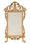 A Continental carved gilt gesso pier mirror:,