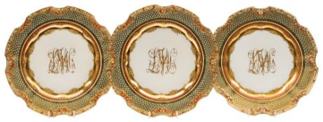 A set of ten Dresden 'jewelled' and monogrammed cabinet plates: the shaped rims with iron-red