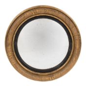 A Regency carved giltwood circular convex mirror:,