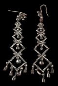 A pair of early 19th century cut-steel pendant earrings: set throughout with faceted steel studs,