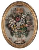 A Victorian oval shell display: of flowers in a vase, contained in an oval case, 40 x 30cm.