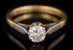 A diamond solitaire ring: the round brilliant-cut diamond 5.7mm diameter x 3.