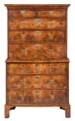 An early 18th Century walnut and crossbanded chest on chest:, the upper part with a moulded cornice,
