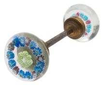 A pair of French glass spaced millefiori door handles: each with two concentric rings of flower