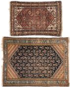 A Hamadan rug:, the indigo field with a geometric lozenge boteh design and pastel blue border,
