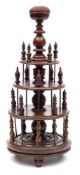 A 19th century rosewood bobbin stand: the central knopped column surmounted by a domed pin cushion,