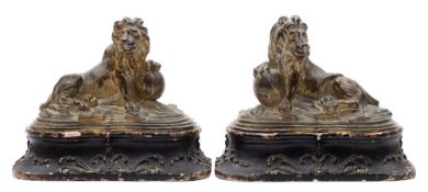 A pair of 18th century gilt-bronze lions: modelled as an opposing pair,