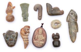 A group of nine various Chinese archaic-style and other carved jade pendants: including a fish,