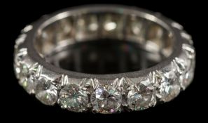 A 20th century diamond eternity ring: pave-set with seventeen round, brilliant-cut diamonds,