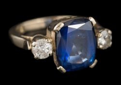 A sapphire and diamond three-stone ring: the central,