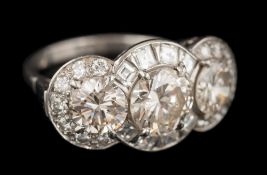 A graduated diamond triple cluster ring: the three principal,