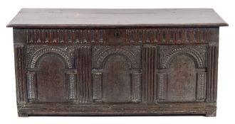 A late 17th Century oak rectangular coffer:, with a moulded hinged top,