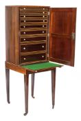 An early 19th Century rosewood and inlaid collectors cabinet on stand:,