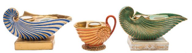 A pair of Paris porcelain ink stands of nautilus shell form and one similar: the pair decorated in