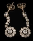 WITHDRAWN A pair of platinum and diamond pendant earrings: each with a circular cluster