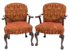A pair of carved mahogany open armchairs in the George II taste:,