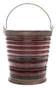 A 19th century Continental mahogany peat bucket: of coopered construction,