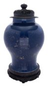 A Chinese blue ground baluster jar: decorated in gilt with flowers and foliage above a lappet band,