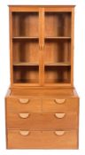 By John Makepeace A fruitwood display cabinet on a chest:,
