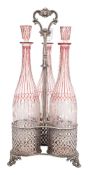 An Elkington and Co silver plated triple bottle stand: with three pierced cylindrical holders
