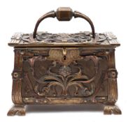 A Continental Art Nouveau period brass and copper casket: the hinged lid with loop carrying handle