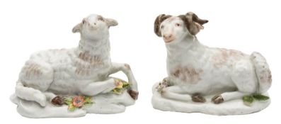 A pair of Chelsea models of a recumbent ewe and ram: their fleeces with greyish brown markings,