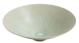 A Chinese Qingbai porcelain bowl: of flared conical form, covered in a crackled pale blue glaze,