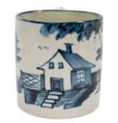 A Bovey Tracey blue and white pearlware small mug or can: painted with a vignette of a cottage,