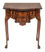 A late 18th/early 19th Century Dutch carved walnut and floral marquetry serpentine fronted side