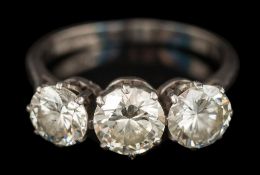 A graduated diamond three-stone ring: with round brilliant-cut diamonds estimated to weigh 0.