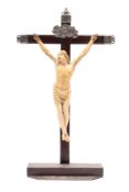 A late 17th/early 18th century Flemish ivory Corpus Christi: mounted on a later hardwood and silver