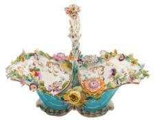 A Coalport porcelain flower basket: of typical rococo form with turquoise and gilt exterior,