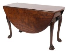 A mid 18th Century red walnut oval drop flap dining table:,
