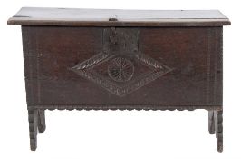 A 17th Century oak rectangular coffer:, of small size and plank construction,