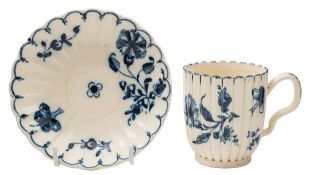 A Bovey Tracey blue and white creamware coffee cup and saucer: of reeded and fluted form with