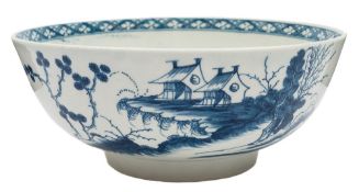 A First Period Worcester blue and white bowl: painted in 'The Precipice' pattern with pavilions in