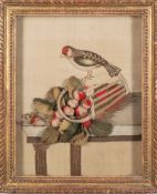 An early 19th century felt and needlework picture: depicting a chaffinch perched on an upturned