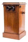 A Victorian mahogany table top stereoscopic viewer:, of typical form with turned handles,