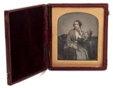Richard Beard ,London , a daguerreotype portrait of a woman seated by a table,