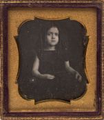 A Victorian daguerreotype portrait of a young girl with her hair in ringlets:, photographer unknown,