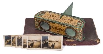 A tinplate Rotoscope 'Pocket Folding Stereoscope' in original box with a part set of 'Views of